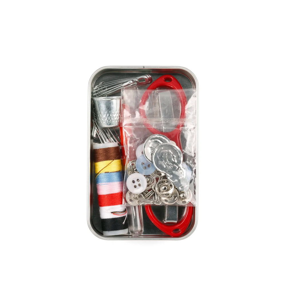 Kikkerland Emergency Sewing Kit in compact tin with sewing needles, thread, and small sewing tools for quick repairs.