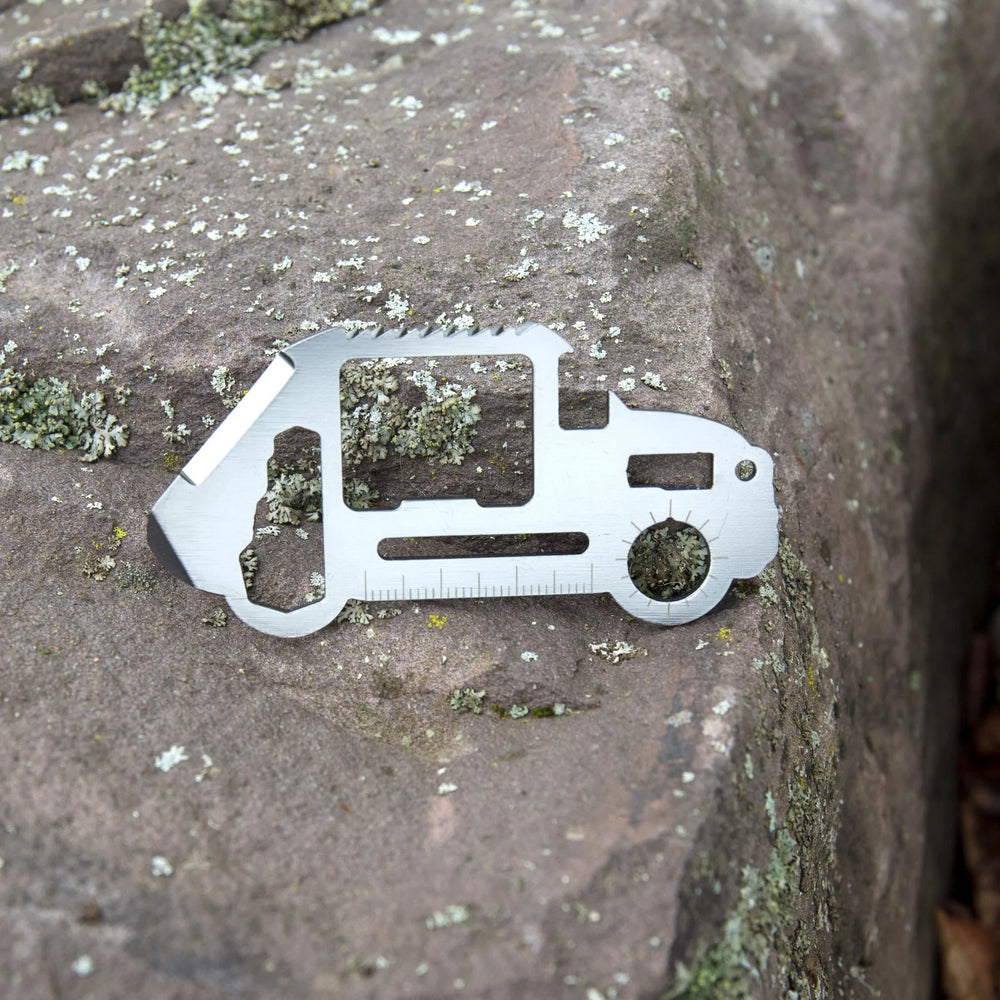 Kikkerland car-shaped survival tool with multiple functions, featuring a compact design and durable metal construction.