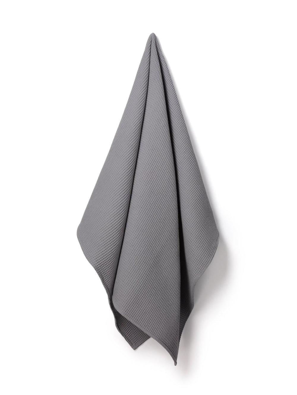 Light grey waffle throw blanket from Cornucopia Worcester featuring a textured, soft woven fabric for cozy comfort.