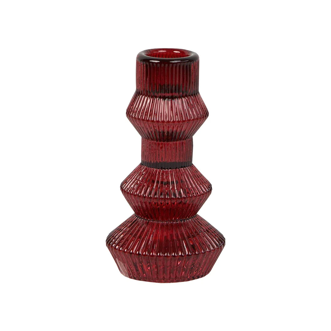 Geometric burgundy red glass candlestick holder by Cornucopia Home and Gift, tall design with intricate geometric patterns.