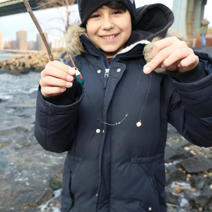 Kikkerland Huckleberry Fishing Kit with a colorful fishing rod and reel, designed for outdoor fishing adventures.