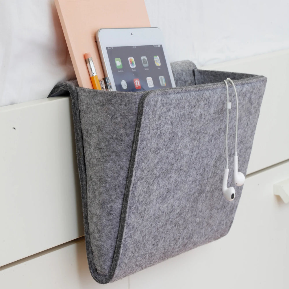 Kikkerland Bedside Pocket by Cornucopia Home and Gift hanging organizer with multiple pockets for bedside essentials