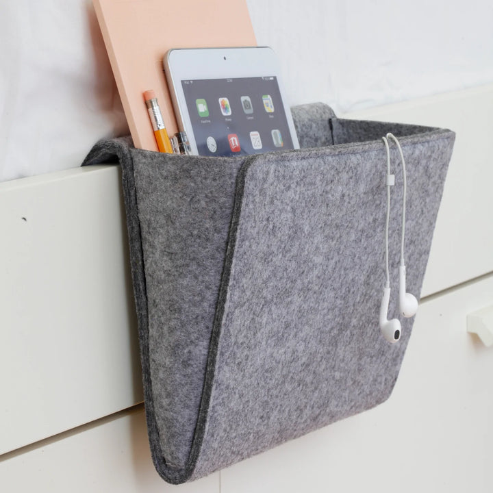 Kikkerland Bedside Pocket by Cornucopia Home and Gift hanging organizer with multiple pockets for bedside essentials