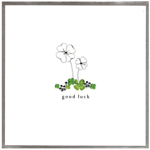 Cinnamon Aitch Good Luck card featuring a colorful, whimsical design with cheerful illustrations on a white background.