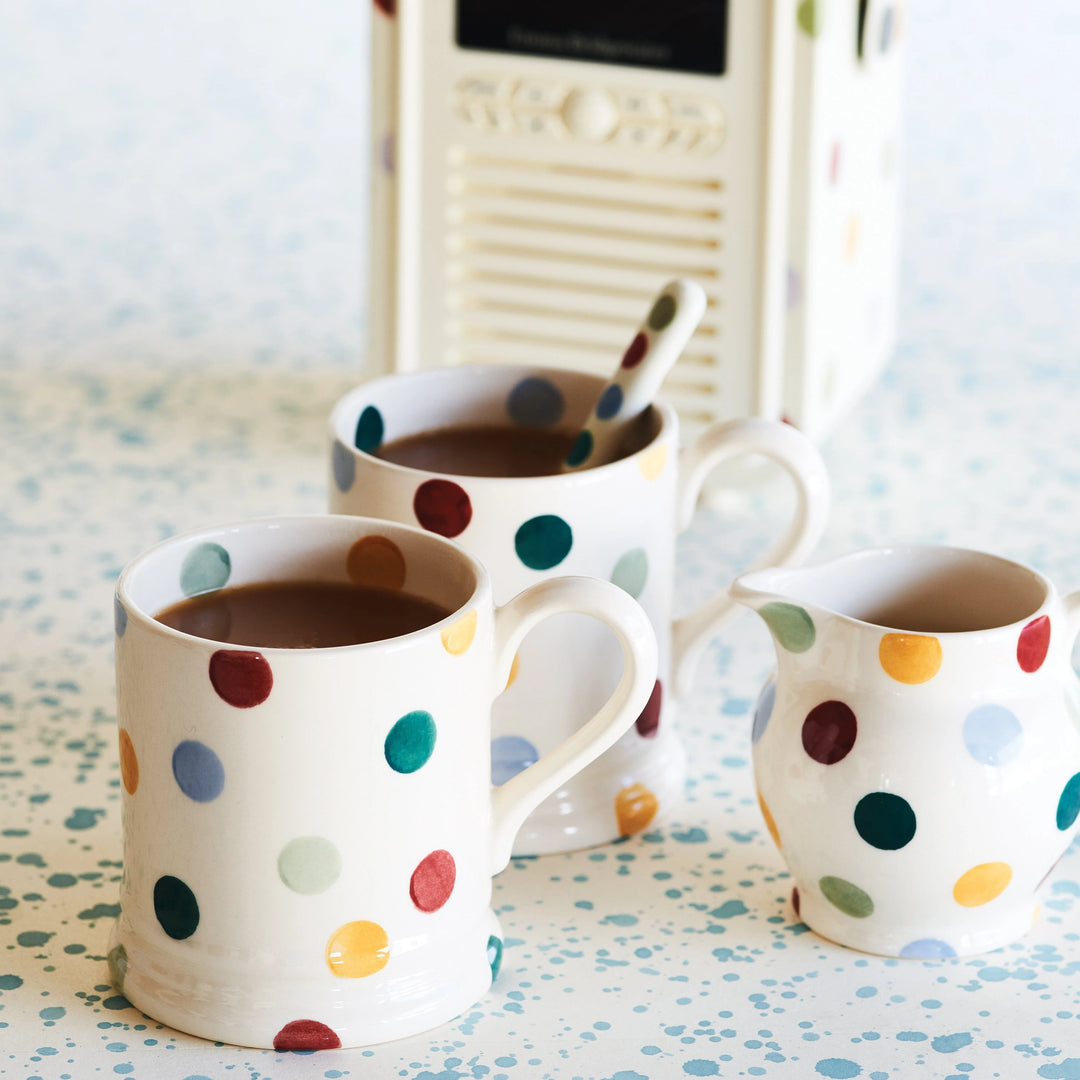Emma Bridgewater Polka Dot Half Pint Mug with small matching milk jug, featuring colorful polka dot design on ceramic.