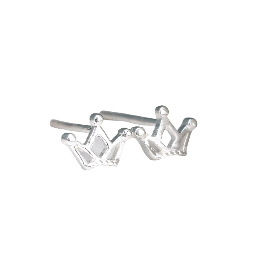 Tiny silver crown stud earrings by POM Jewellery from Cornucopia Worcester, featuring delicate crown designs on small silver studs.