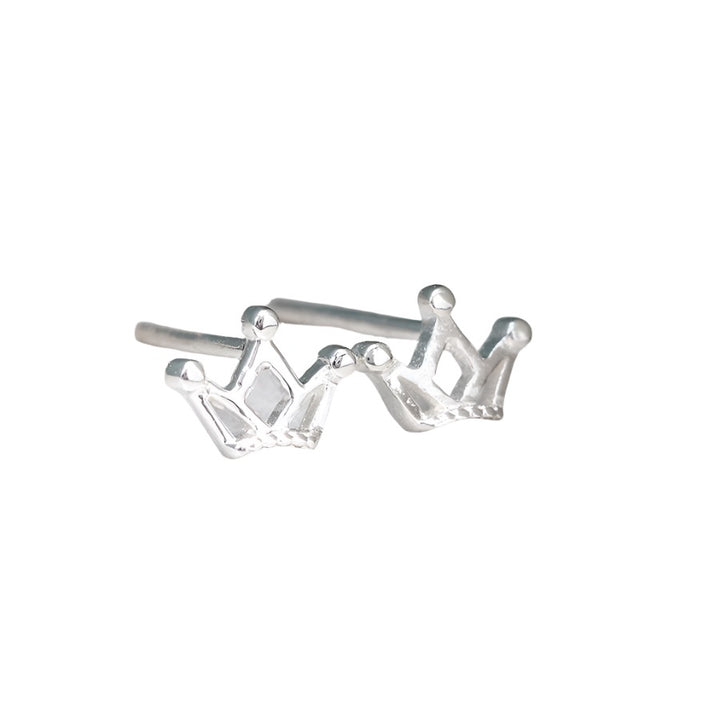 Tiny silver crown stud earrings by POM Jewellery from Cornucopia Worcester, featuring delicate crown designs on small silver studs.