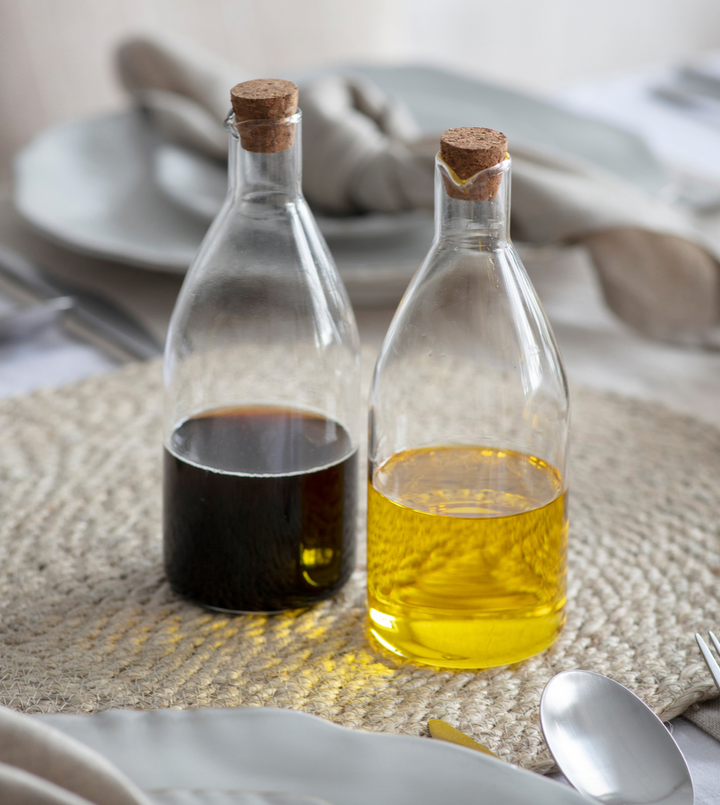 Garden Trading Cornucopia Worcester glass oil and vinegar bottle set, clear glass bottles with stoppers for kitchen storage.