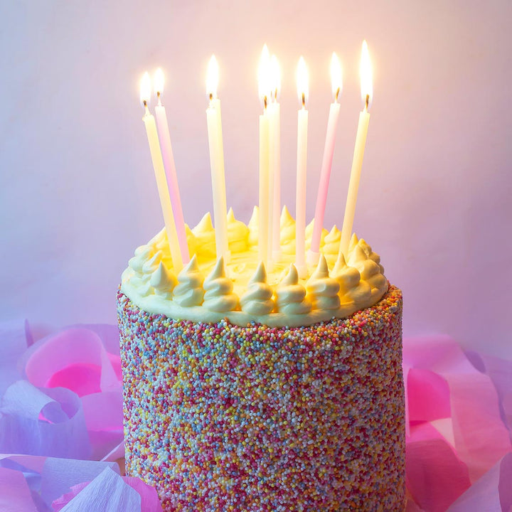 Set of 16 tall pastel candles from Cornucopia Home and Gift, 10cm height, featuring smooth, colorful wax in a square arrangement.