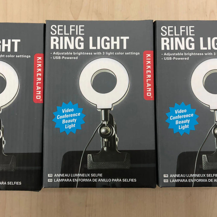 Kikkerland Selfie Ring Light by Cornucopia Home and Gift, showing adjustable brightness ring with phone holder attachment.