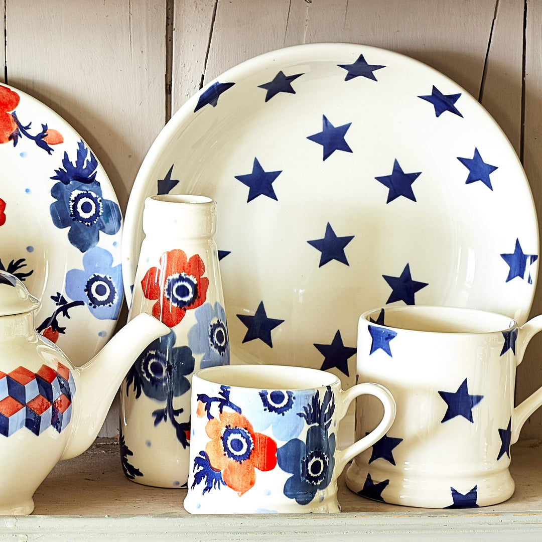 Emma Bridgewater Blue Star Half Pint Mug and matching pasta bowl with blue star pattern on ceramic tableware set.