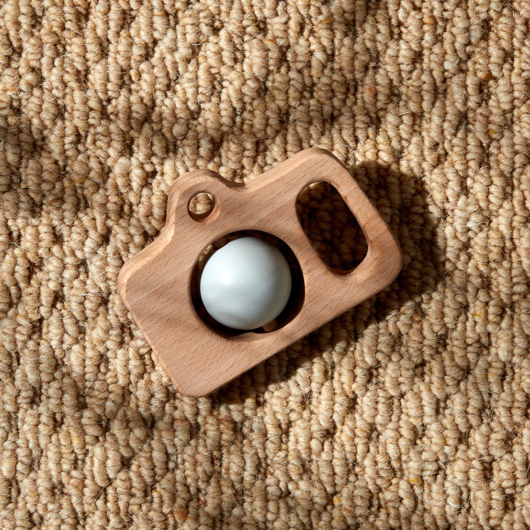 Wooden silicone camera teether by Cornucopia Worcester, featuring a wooden frame and silicone details, perfect for babies.