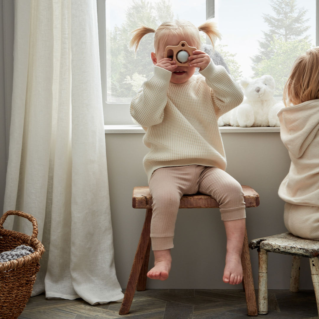 Wooden silicone camera teether by Cornucopia Worcester, featuring a natural wood and silicone design for sensory development.