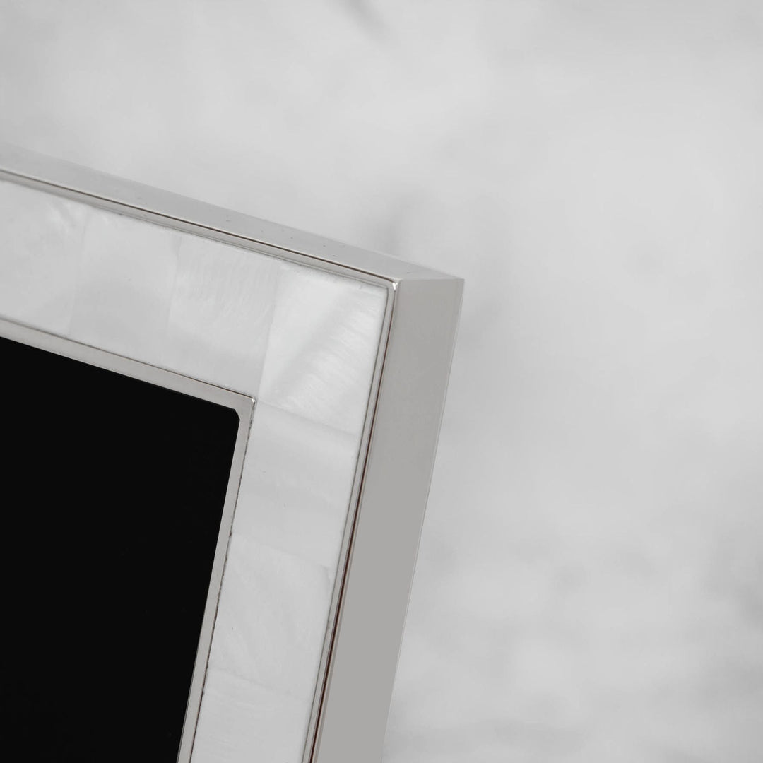 Elegant metal and mother of pearl photo frame by Widdop &amp; Co, featuring intricate design and a polished finish.
