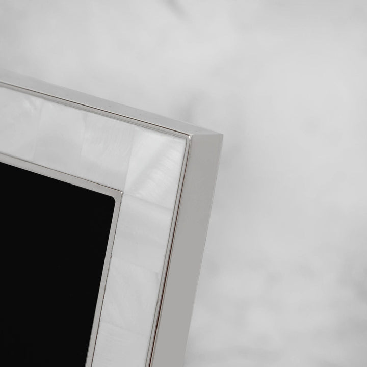 Elegant metal and mother of pearl photo frame by Widdop &amp; Co, featuring intricate design and a polished finish.