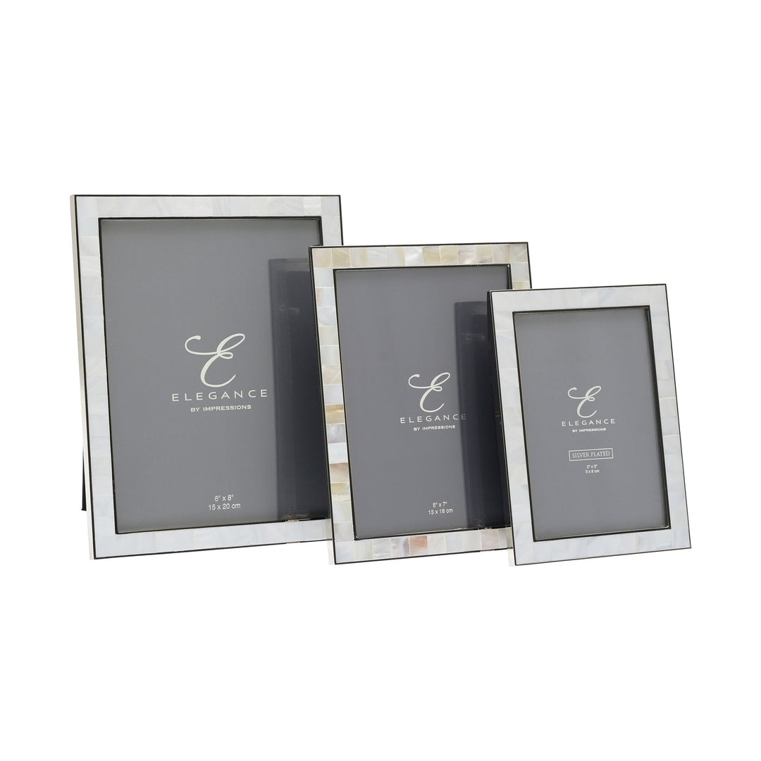Metal and mother of pearl photo frame by Widdop &amp; Co, Cornucopia Home and Gift, showcasing a decorative frame with intricate design.