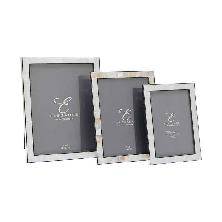 Metal and mother of pearl photo frame by Widdop &amp; Co, Cornucopia Home and Gift, showcasing a decorative frame with intricate design.