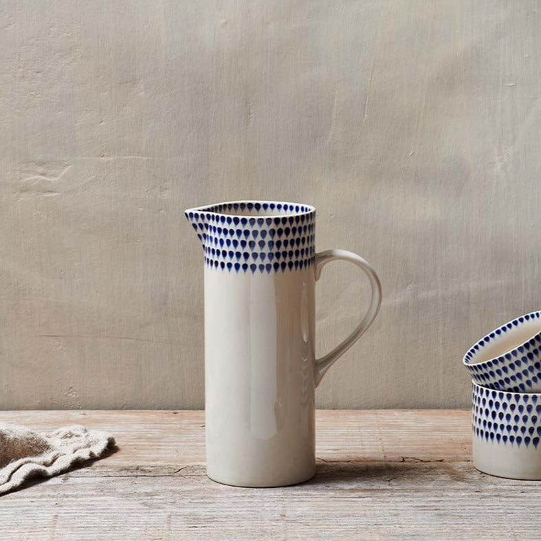 Nkuku Indigo Drop Jug with rounded handle and glazed ceramic finish, ideal for serving beverages or as a decorative piece