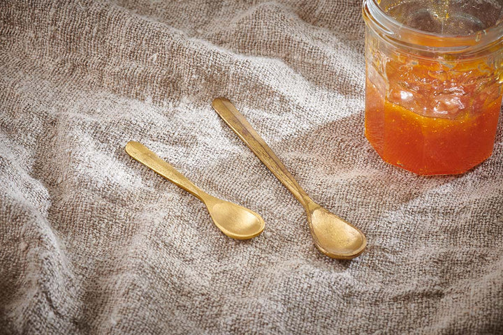 Nkuku Jahi Spoons set of 2 with brushed gold finish, elegant stainless steel spoons for serving or everyday use.